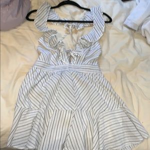 Brand new open back romper. Tags still on!